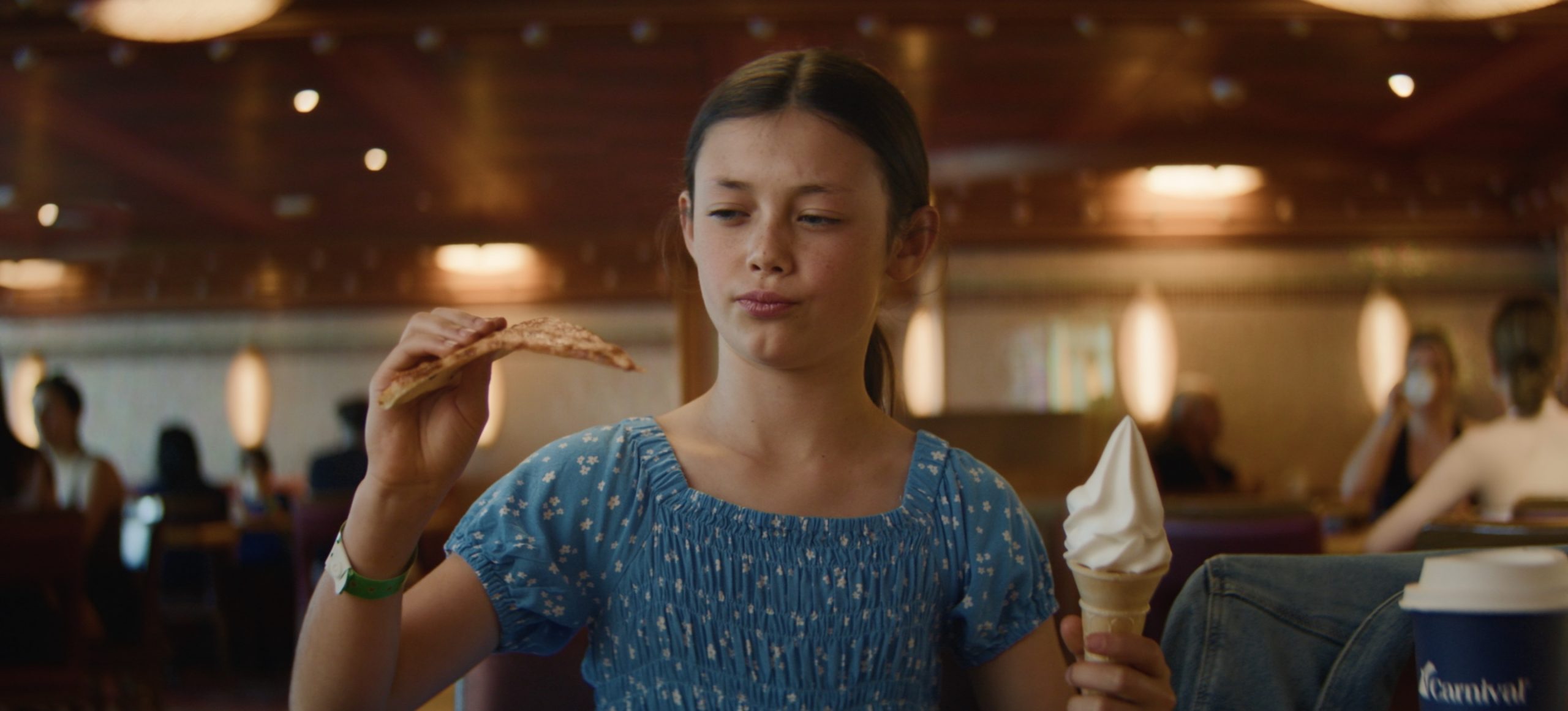 Girl holding a pizza and ice-cream